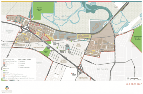 A detailed map of area m-2, featuring zones for housing, industry, and parks with labels and symbols for various landmarks and roads.