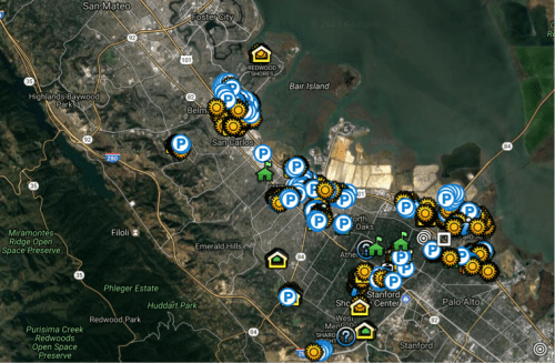 Aerial map view showing various icons indicating points of interest and parking areas around the redwood city area.