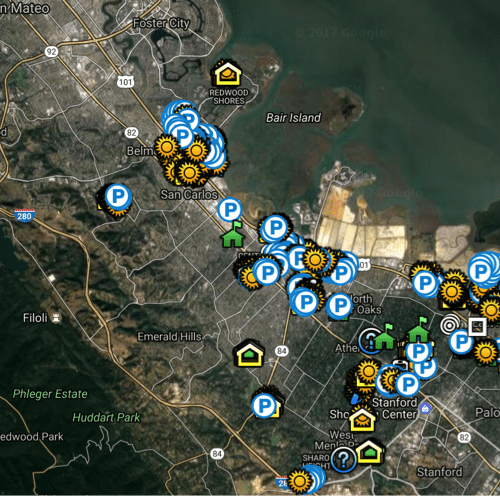 Aerial map view showing various icons indicating points of interest and parking areas around the redwood city area.