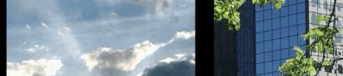 Panoramic image showing a wind turbine against a clear sky, partly cloudy skies, and a skyscraper with green foliage reflections.