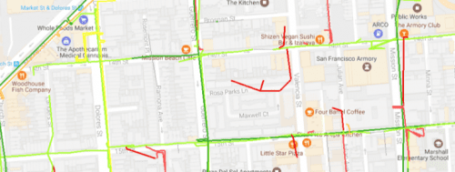 Map image showing streets and landmarks in a san francisco neighborhood with highlighted routes in red and green.