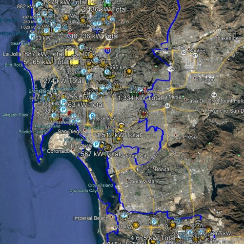 Satellite map highlighting san diego area with various markers showing energy statistics like kilowatt totals. coastal and mountain terrains are visible.