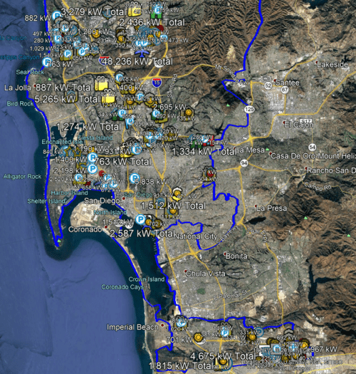 Satellite map highlighting san diego area with various markers showing energy statistics like kilowatt totals. coastal and mountain terrains are visible.