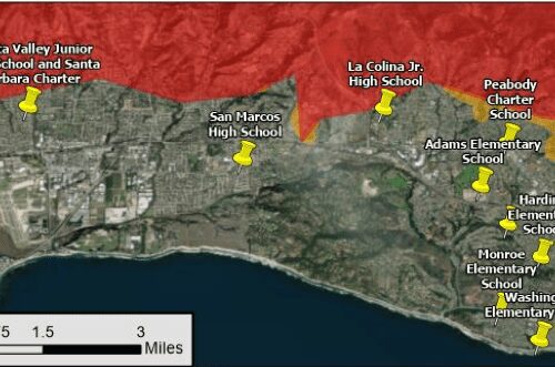 Map showing fire threat levels in a coastal area with marked schools, highlighting regions in tier 2 and tier 3 fire threat zones.
