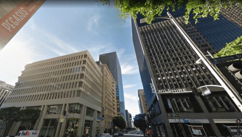 City street scene with tall buildings.
