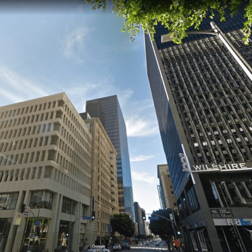 City street scene with tall buildings.