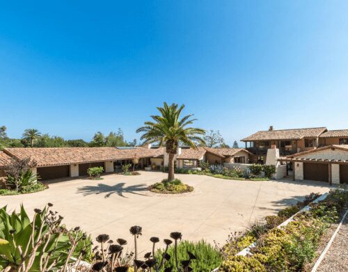 Mediterranean estate with central palm and courtyard