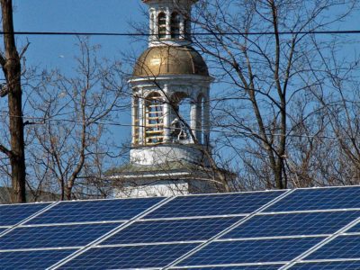 A solar panel sitting on top of a roof.