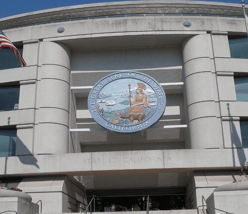 A building with a large circular sign on the front of it.