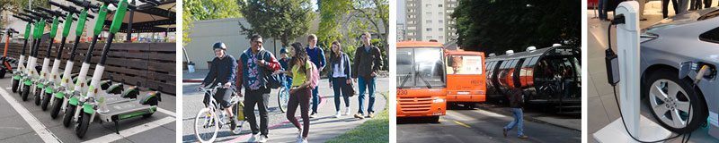 A group of people walking down the sidewalk and in front of a bus.