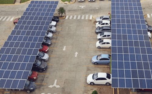 A parking lot with many cars parked in it