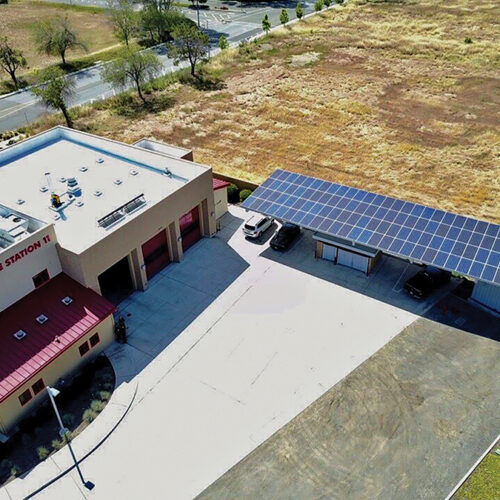 A fire station with a solar panel on the roof.