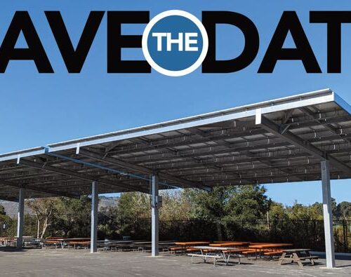 A large metal structure with picnic tables underneath it.