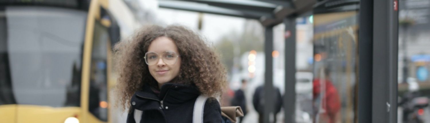 A blurry picture of a woman with curly hair.