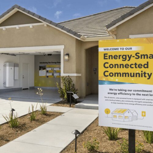 A sign in front of a house that says 