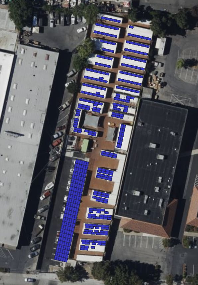 A view of an aerial photo of a building with solar panels.