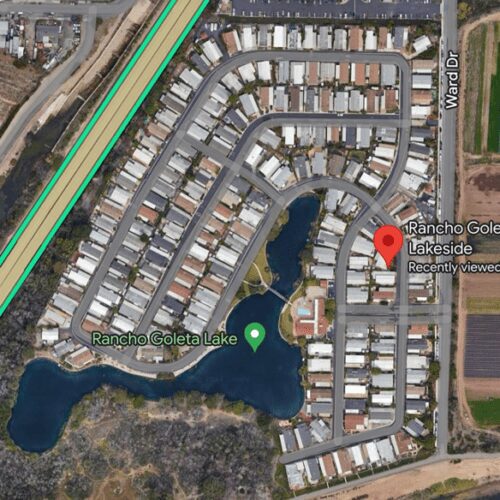 Residential area near a lake, aerial view.