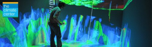 Person interacting with colorful digital climate display.