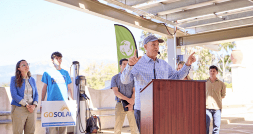 Man speaking at a solar energy event.