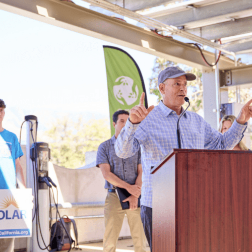 Man speaking at a solar energy event.