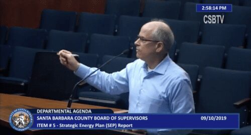 Man speaking at county board meeting