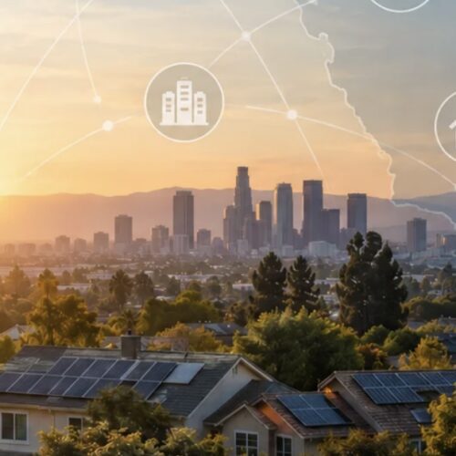 City skyline at sunset with solar rooftops.