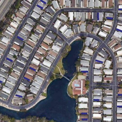 Aerial view of residential neighborhood and fields.